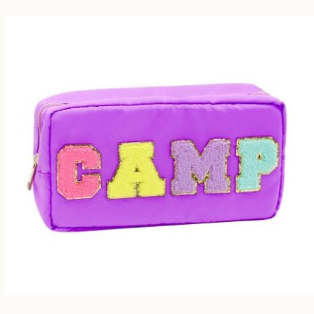 Product photograph of a purple nylon pouch on a white background featuring the word CAMP in multi-colored chenille patches with gold glitter borders and a gold-tone zipper