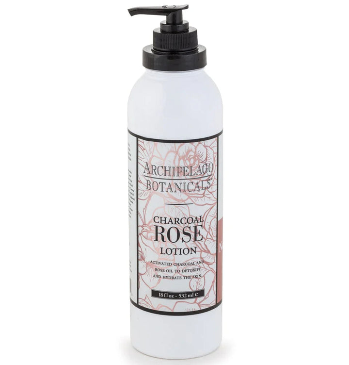 Product photograph of Archipelago Botanicals Charcoal Rose Lotion on a white background featuring a signature pink floral label, a black pump dispenser, and intricate line art