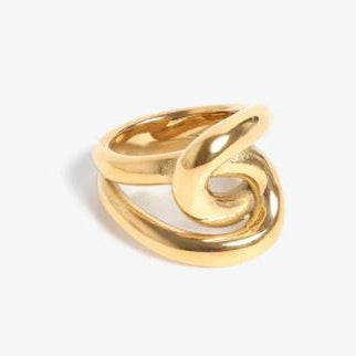 Polished gold sculptural ring featuring fluid intertwined loops and a thick tubular design with a high-shine finish set against a neutral white background