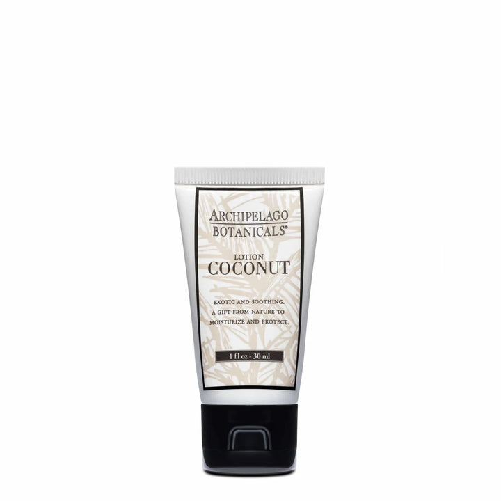 Commercial product photograph of Archipelago Botanicals Coconut Lotion presented in a travel-sized white tube with a beige palm leaf motif, black serif branding, and a glossy black flip-top cap against a neutral white background