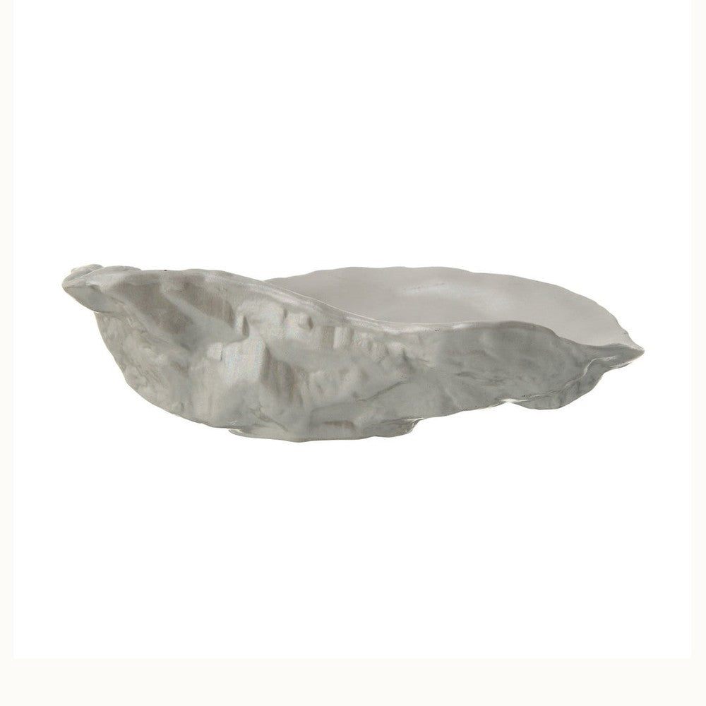 Limoges porcelain by L'Objet, a large oyster shell bowl is centered on a white background featuring a realistic textured grey exterior, a smooth cream interior, and organic scalloped edges