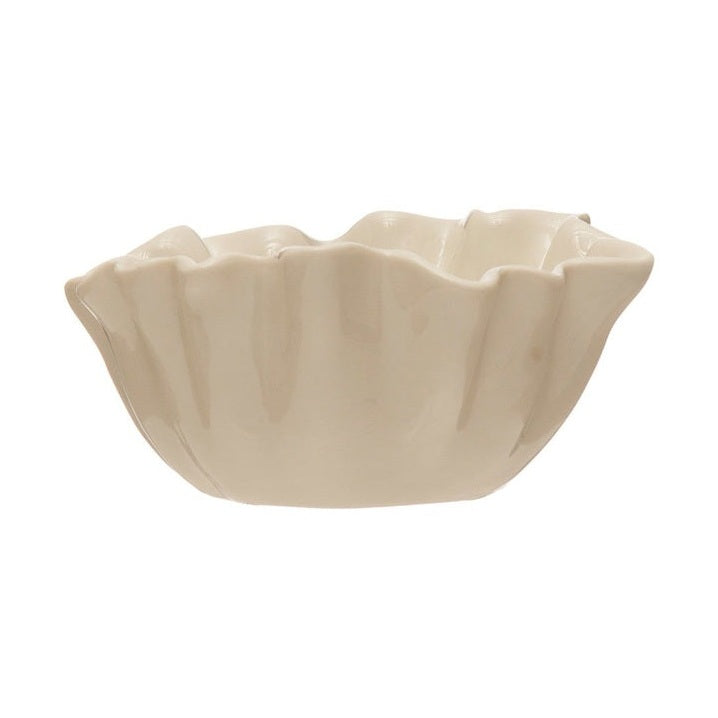Ceramic stoneware ruffled bowl showcased on a clean white background featuring a lustrous cream glaze and distinctive wavy organic ridges along the rim