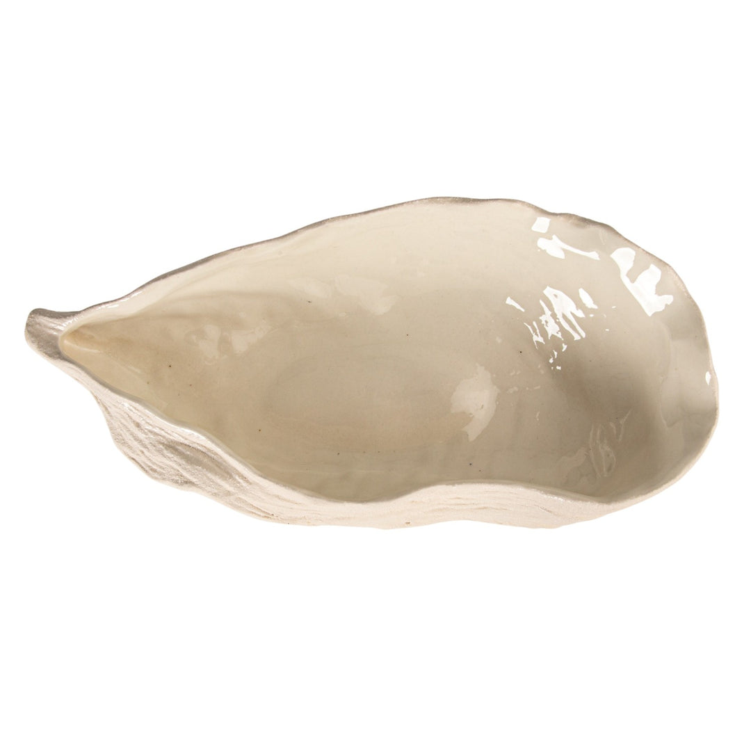 Ceramic oyster-shaped serving bowl centered on a white background featuring a glossy off-white glaze, realistic exterior shell ridges, and a unique organic scalloped rim