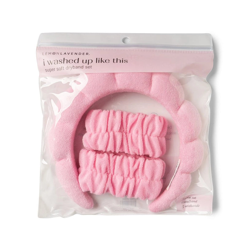 Product photograph of a Lemon Lavender pink dryband set featuring a puffy cloud-contoured headband and two gathered wristbands inside clear packaging displaying the text i washed up like this on a white background