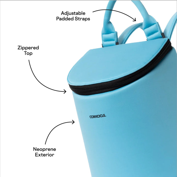 Digital product photograph by Corkcicle of a vibrant sky blue neoprene backpack cooler on a white background featuring a contrasting black zippered top, adjustable padded straps, and a minimalist black logo