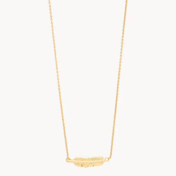Gold jewelry necklace featuring a horizontal feather pendant centered on a white background with a delicate link chain and intricate textured barbs