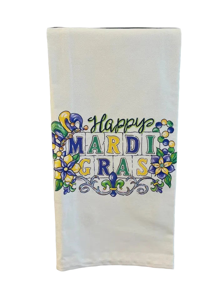 Illustrated decorative tea towel featuring a Happy Mardi Gras typographic design celebrating New Orleans culture with a vibrant jester hat, intricate fleur-de-lis scrollwork, and festive purple, green, and gold beads