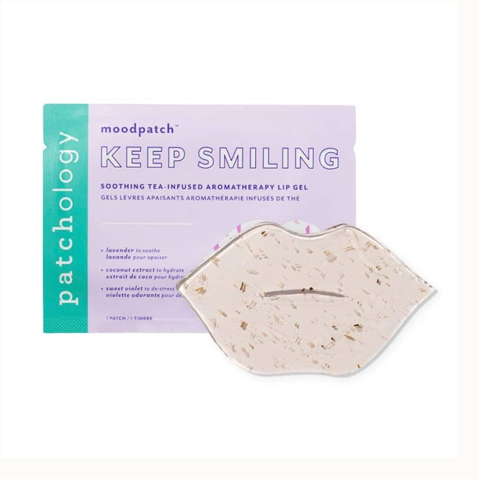 Product photograph by Patchology featuring the Keep Smiling aromatherapy lip gel with a clear, lip-shaped mask containing visible dried botanical pieces resting on lavender and teal packaging with the iconic vertical brand logo