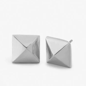 Silver stud earrings featuring a pair of polished square pyramid studs on a white background with sharp-angled peaks and a reflective metallic finish