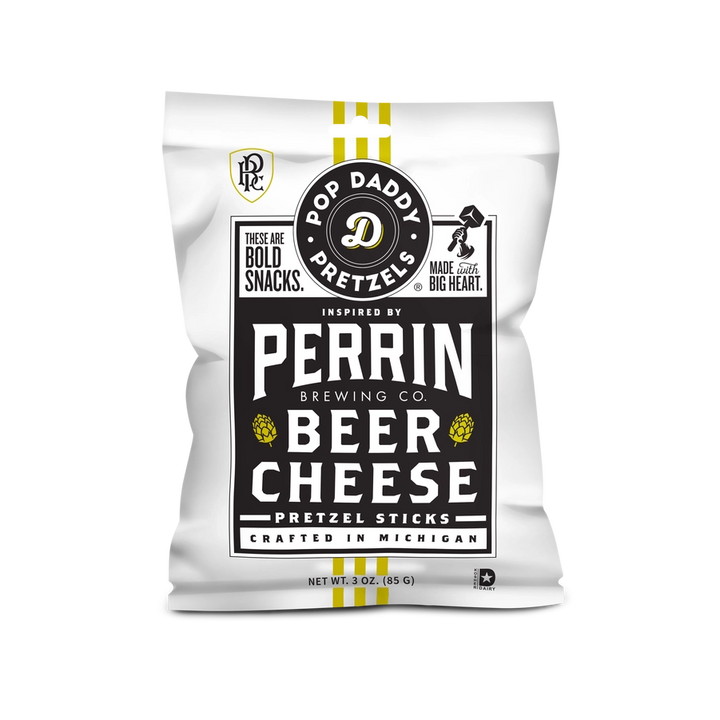 Product packaging graphic for Pop Daddy Pretzels featuring a white bag of Beer Cheese Pretzel Sticks inspired by Perrin Brewing Co. in Michigan with yellow hop icons and vertical yellow stripes