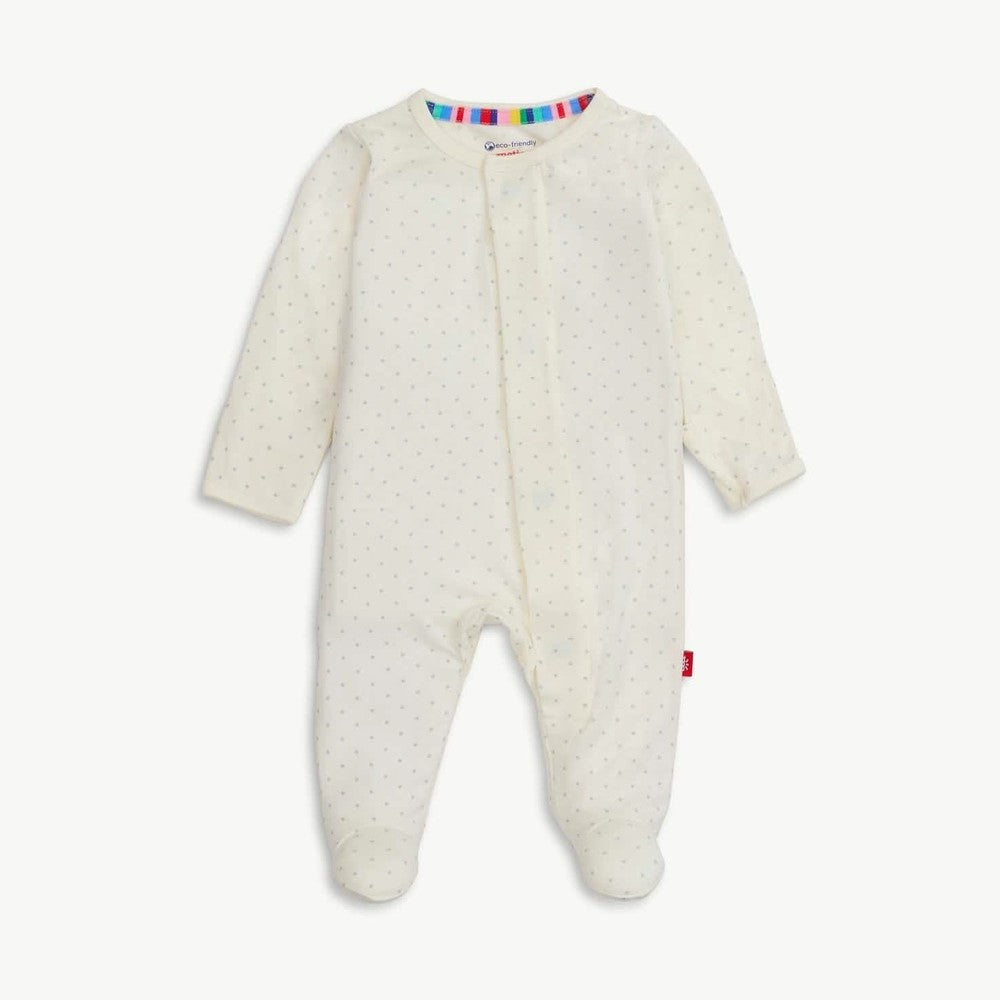 Product photograph of a Mori brand baby onesie featuring an off-white footed sleepsuit with a subtle grey star pattern, a vibrant rainbow-striped inner neckline, and a signature red logo tag on the side seam