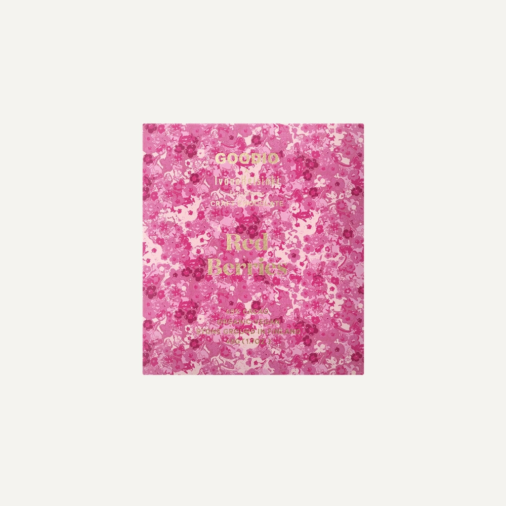 Packaging design by Goodio featuring a Red Berries craft chocolate bar centered on an ivory background with an intricate pink floral pattern and shimmering gold foil typography