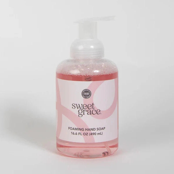 Product photograph of Bridgewater Candle Company Sweet Grace Foaming Hand Soap on a neutral studio background featuring pink-tinted liquid, a white pump dispenser, and a label with soft pink swirl patterns