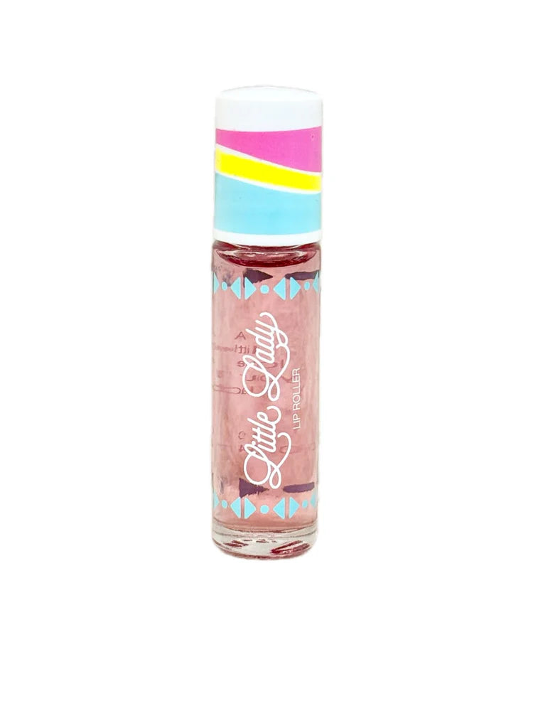 Commercial product photograph by Little Lady of a lip roller on a white background featuring a clear tube with pink-tinted liquid, a multi-colored cap with pink and yellow stripes, and blue geometric triangle patterns surrounding the iconic white cursive logo