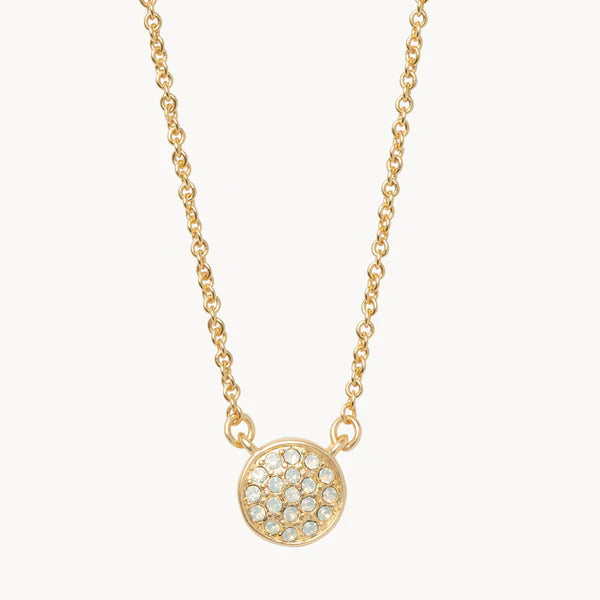 Gold-tone crystal necklace featuring a circular pave-set pendant centered on a delicate cable chain against a white background, highlighting the shimmering clear stones and polished metallic finish