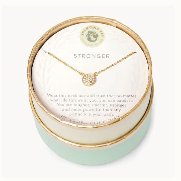 18kt gold plated necklace by Spartina 449 featuring a pave-set crystal circle pendant displayed inside a round mint-colored gift box with the Daufuskie Island mermaid logo and the word STRONGER inscribed on a white insert card