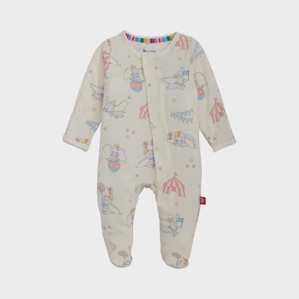 Printed cotton baby sleepsuit by Disney featuring Dumbo the elephant in a circus setting with red striped tents, blue flags, and a rainbow-patterned inner neckline collar