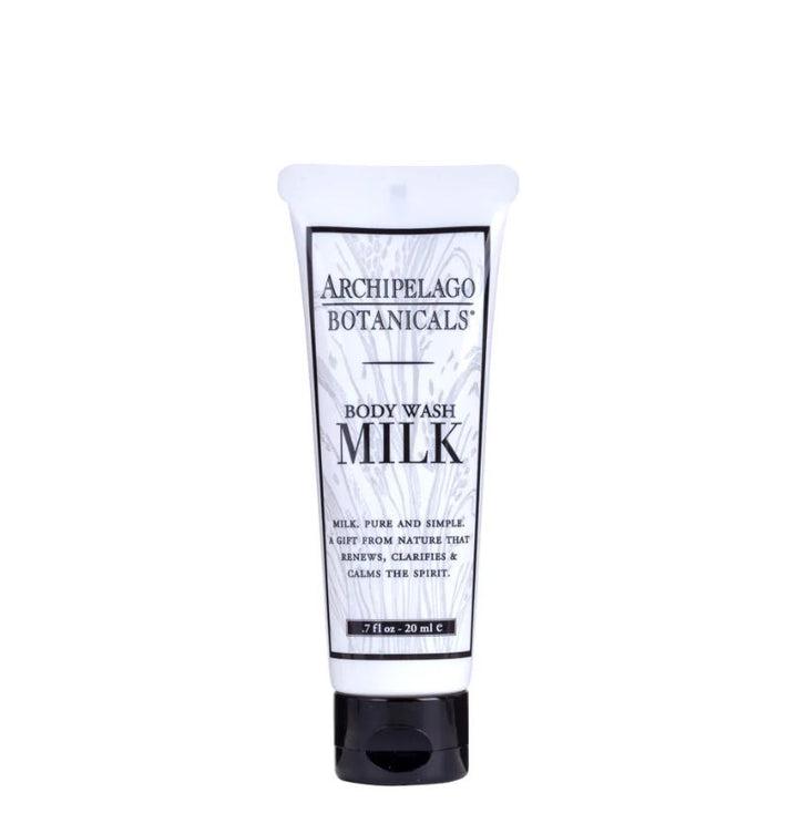 Digital product photograph by Archipelago Botanicals featuring a travel-sized tube of Milk Body Wash on a white background, showcasing a black flip-top cap, monochrome botanical label sketches, and bold black Milk branding