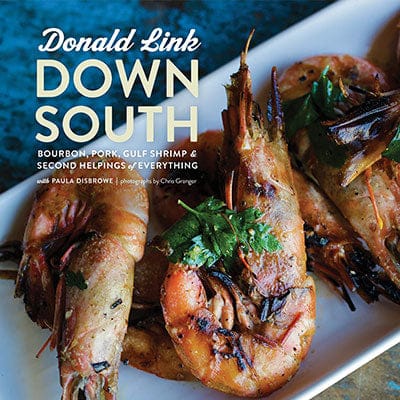 Book cover photograph by Chris Granger for author Donald Link featuring charred head-on Gulf shrimp from the American South with fresh cilantro garnish and bold yellow typography against a blue background