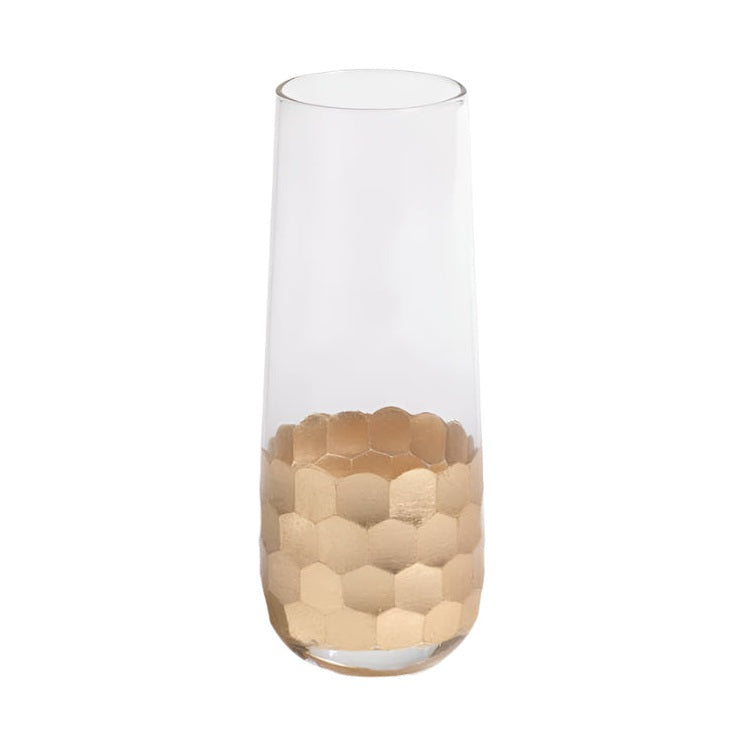 Glass stemless champagne flute featuring a shimmering gold honeycomb pattern on the base and a clear tapered silhouette against a white background