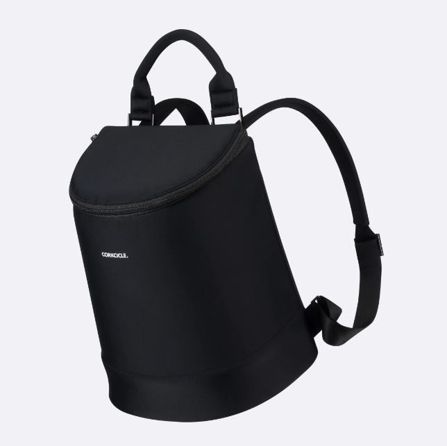 Corkcicle black cooler backpack against a plain white background featuring a sleek cylindrical silhouette, a padded top handle, and a minimalist white logo
